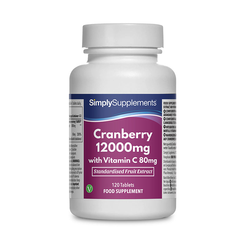 Frasco de suplemento con la etiqueta «Arándanos 12000mg y Vitamina C 80mg Simply Supplements», de color rosa sobre fondo blanco.