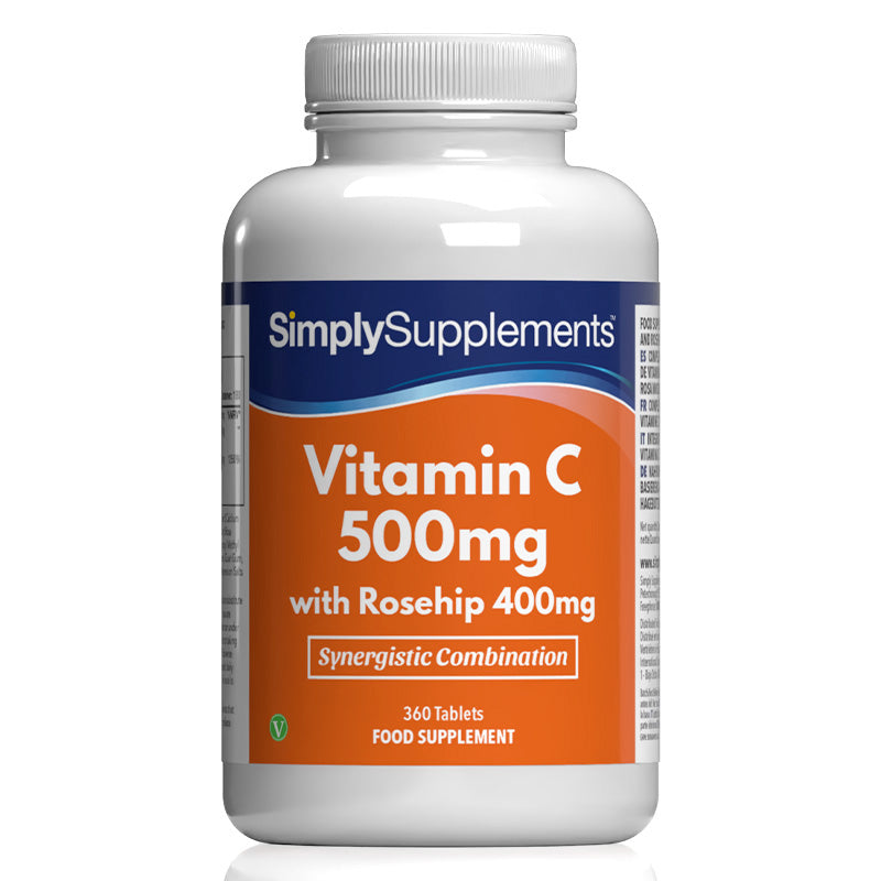 Frasco de suplemento con la etiqueta «Vitamina C 500mg con Rosa Mosqueta 400mg Simply Supplements», de color naranja sobre fondo blanco.